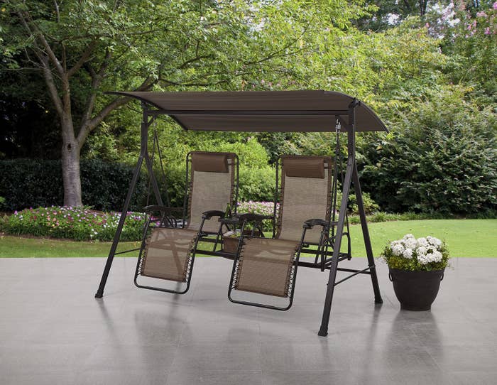 the two zero gravity chairs attached under a canopy