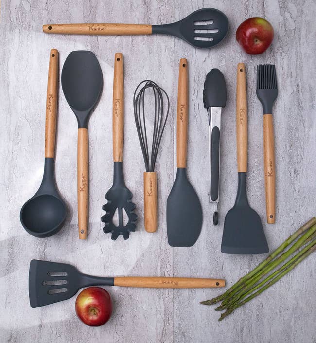 The set of 10 utensils with black silicone heads displayed on a table