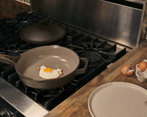 gif of the pan being used to cook eggs and then using the basket to steam dumplings