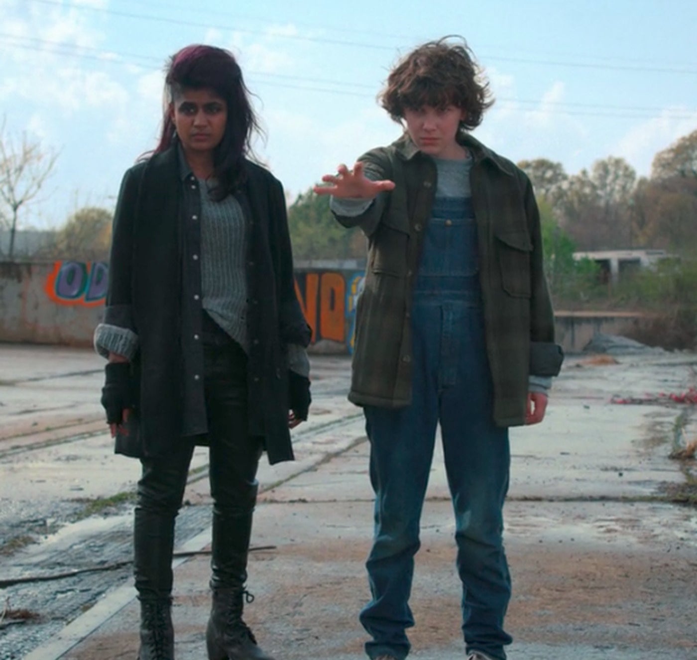 Eleven and Kali standing next to each other