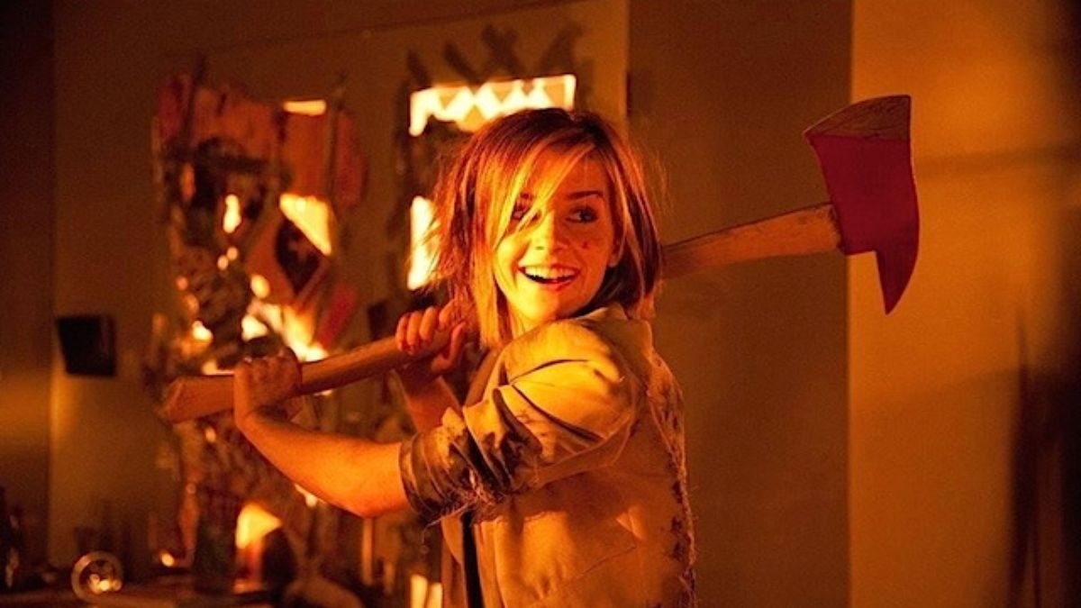 Emma Watson swings an axe