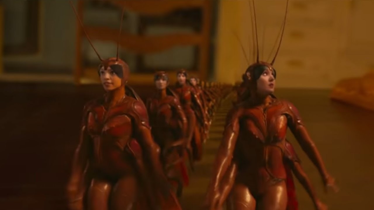 CGI cockroaches that have human body shapes and faces.