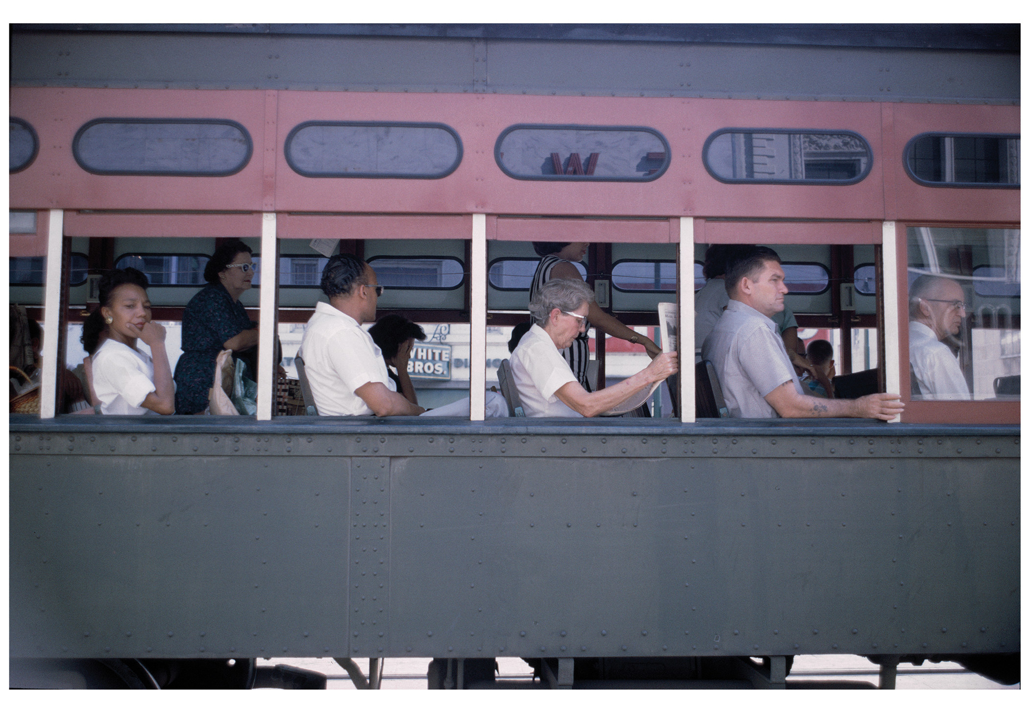 People sit on a city bus