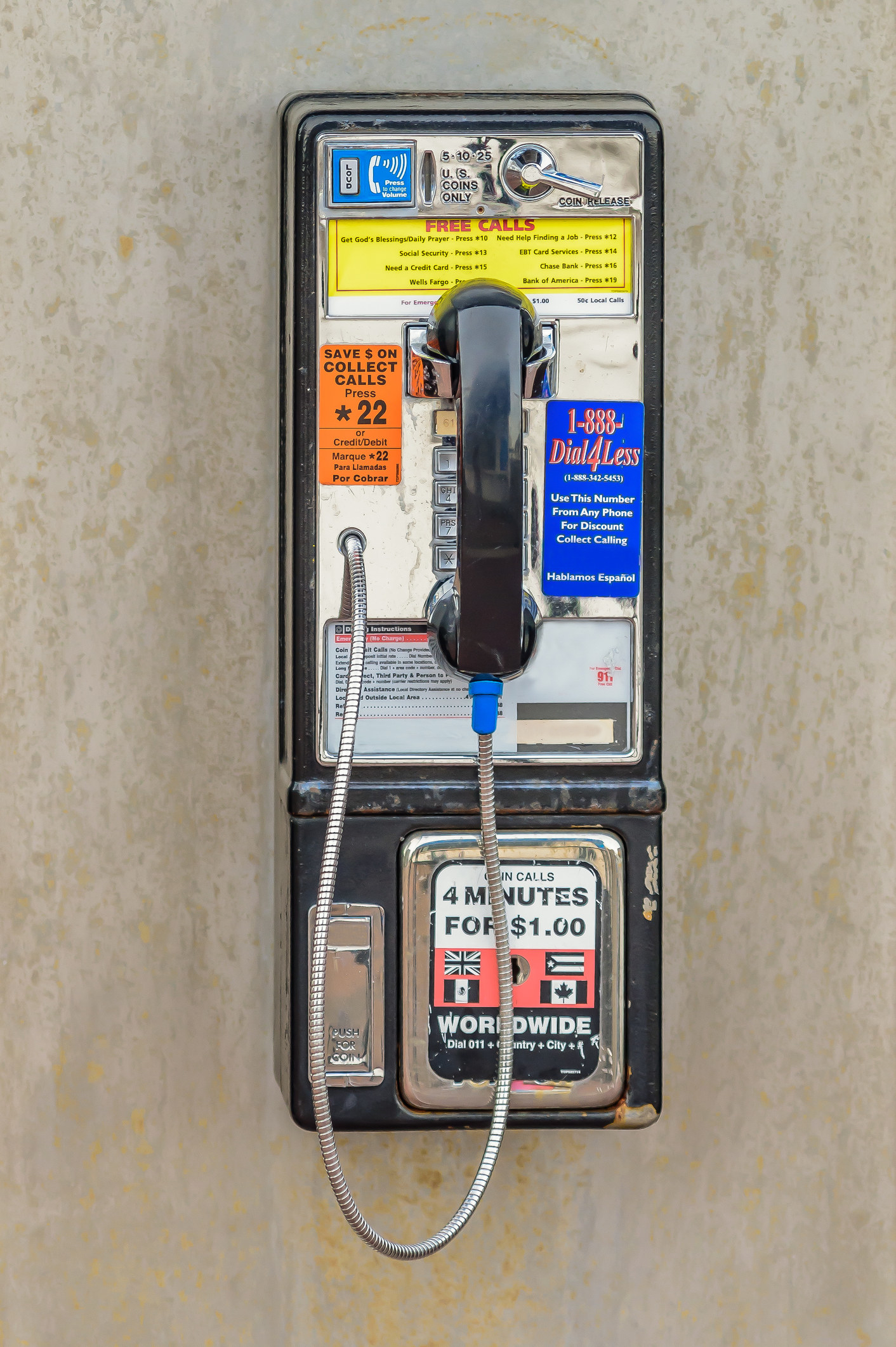 A stock photo of beat up pay phone.