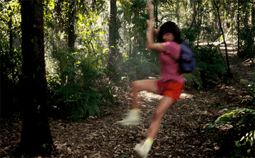 Dora the Explorer swinging around the jungle in street clothes. 
