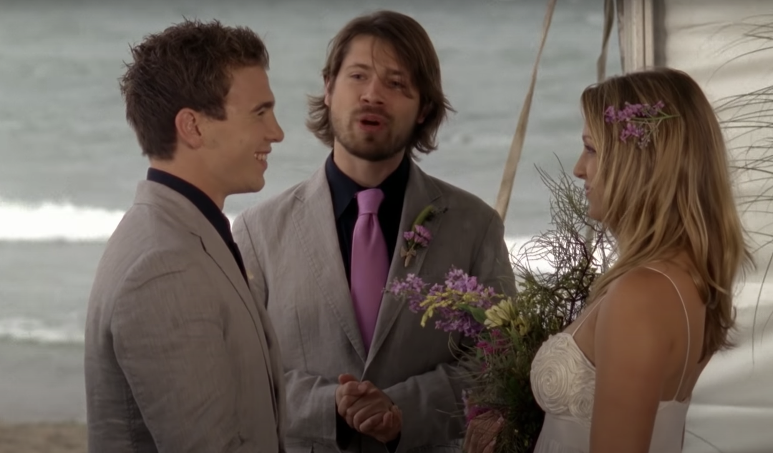 Spinner and Emma standing at the altar