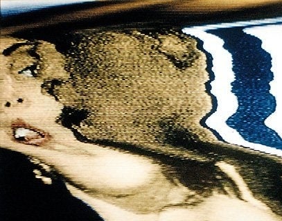 A scrambled TV image of a women's head.
