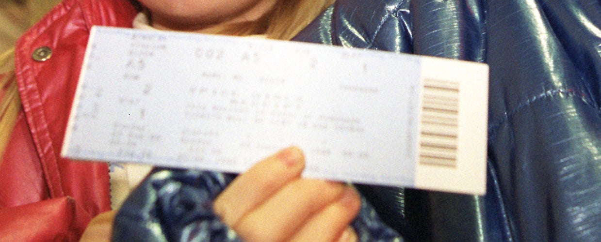 A close-up of a paper ticket. 