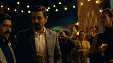 Diego Luna cheers-ing in &quot;Narcos.&quot;