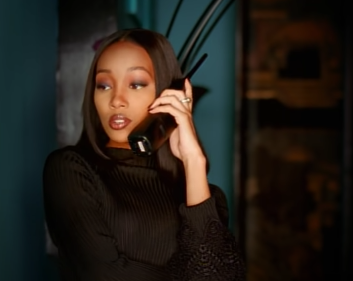 A screengrab of Monica from the &quot;Boy Is Mine&quot; music video talking on a portable phone.