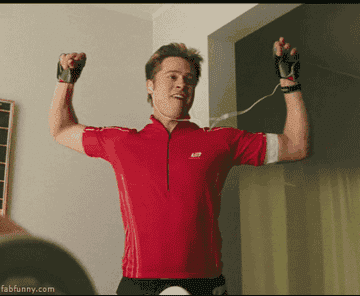 GIF from &quot;Burn After Reading&quot; of Brad Pitt dancing in in workout clothes 