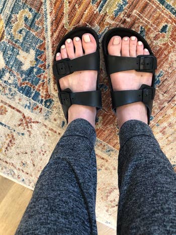 Reviewer wearing the sandals in black