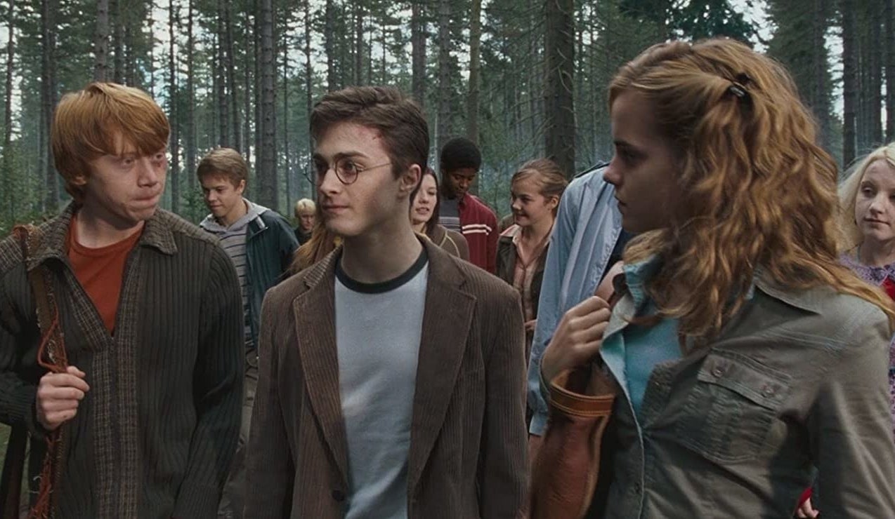 Harry, Ron &amp;amp; Hermione from the Harry Potter movies in a woodland clearing with some others