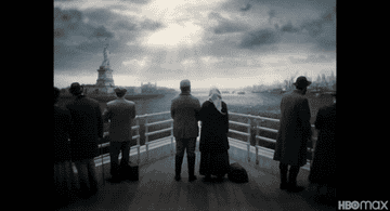 Herschel and his wife pass the Statue of Liberty on their way into America.