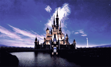 Gif of the intro scene of classic Disney movies, showing the disney castle with fireworks exploding above and &quot;Walt Disney Pictures&quot; appearing below.