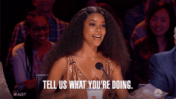 GIF from America&#x27;s Got Talent saying &quot;tell us.&quot;