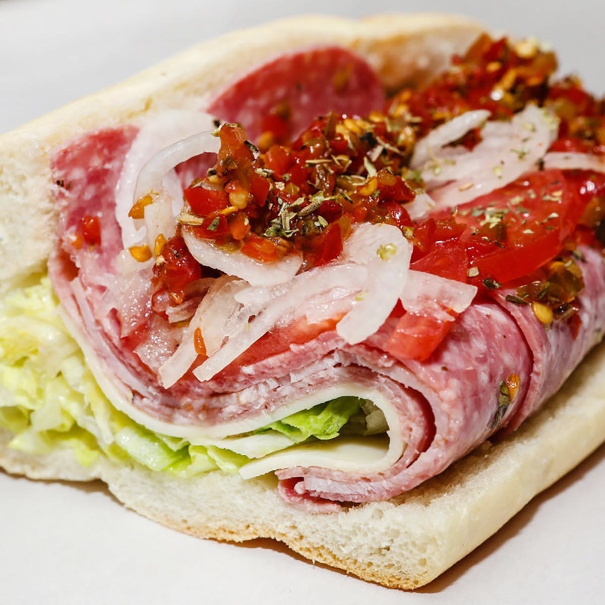 A White House special sub with lots of deli meat, provolone, onions, lettuce, and hot pepper.