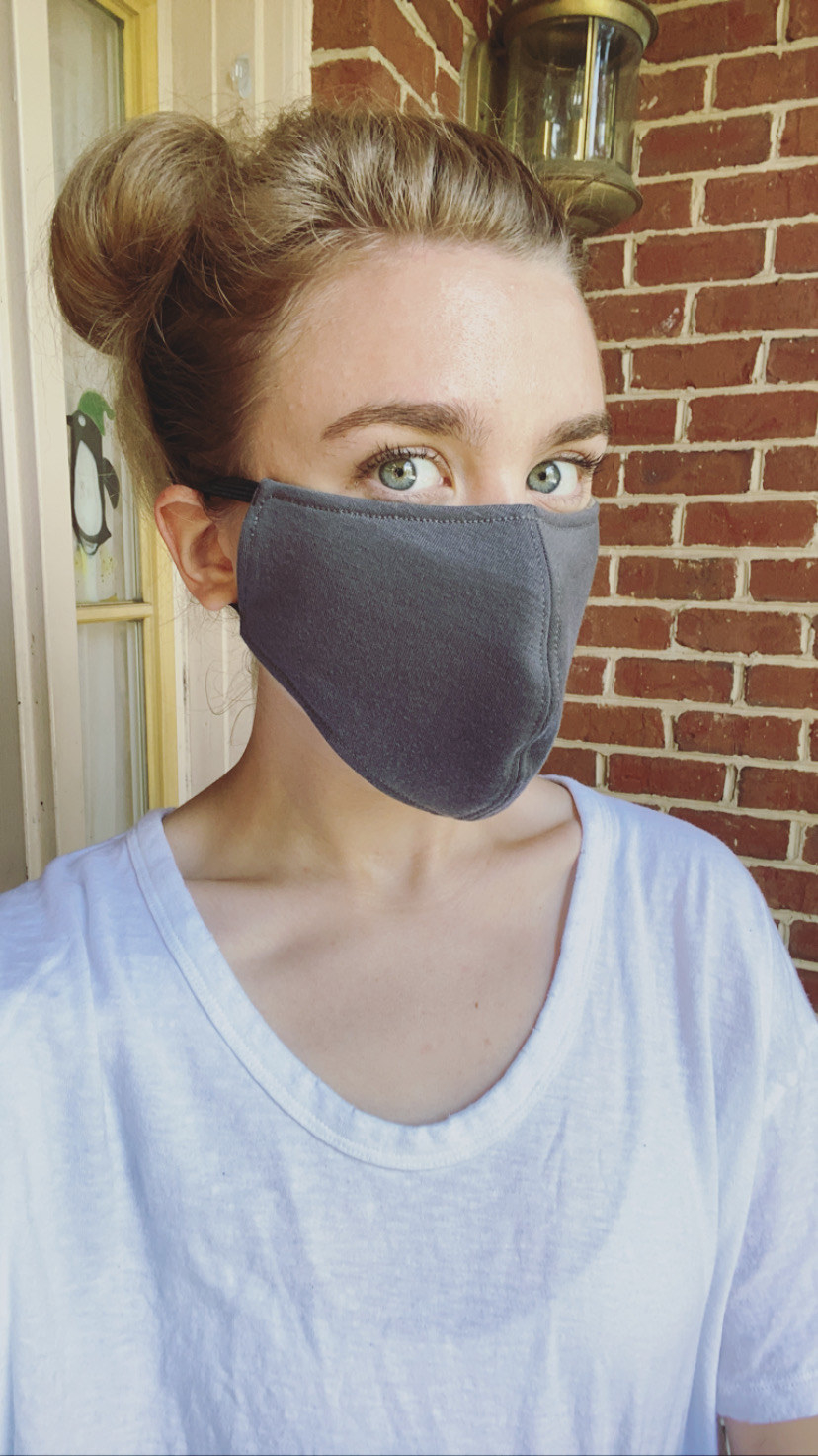 A BuzzFeed editor in a gray face mask 