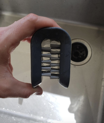 reviewer photo of bristled gray brush 