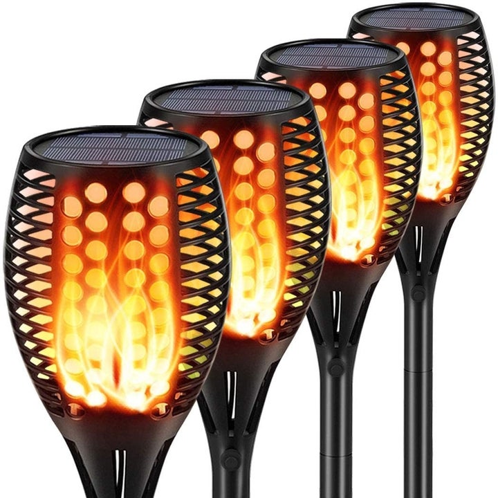 Product shot of four solar tiki torches 