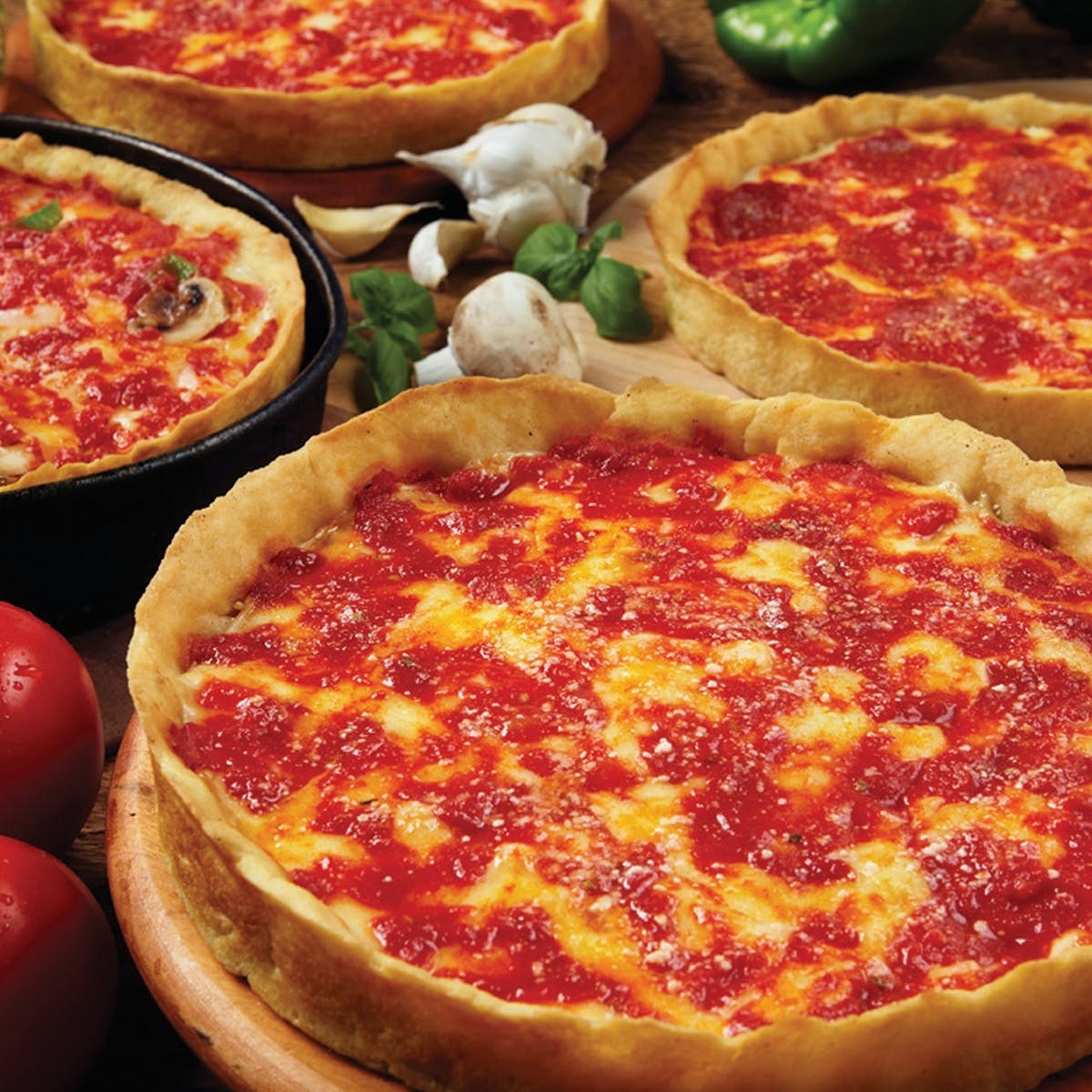 Four deep dish cheese pizzas from Lou Malnati's.