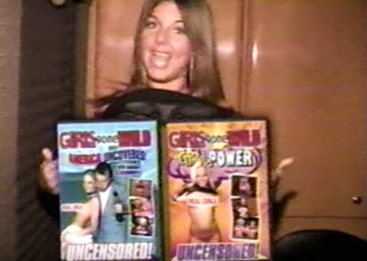 A screengrab of girl flashing the screen and being covered by two large DVD cases in a &quot;Girls Gone Wild&quot; commerical. 