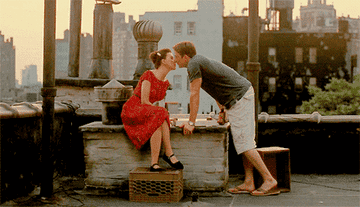 Hayden and Annie kissing on their New York rooftop. 