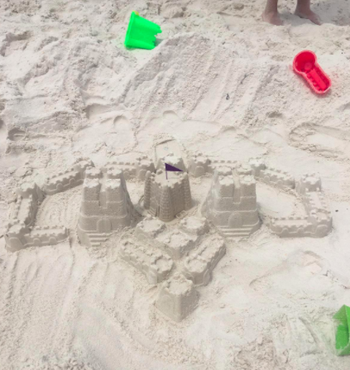 A reviewer's beautiful sand castle and fort created with the toy set 