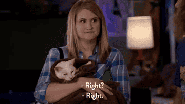 Gif of woman holding a cat.