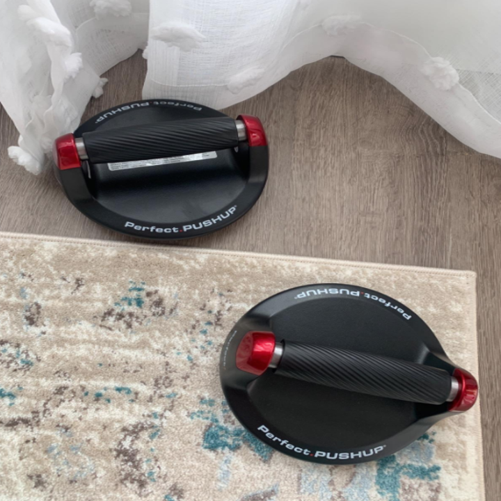 Both push up bars on the floor