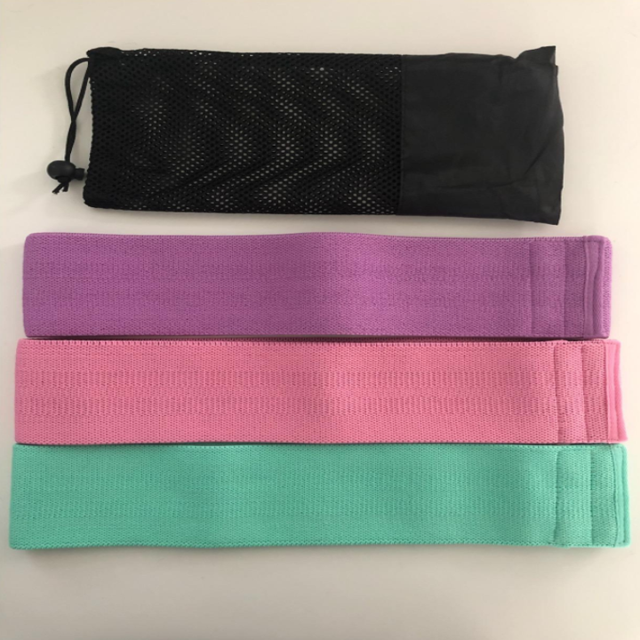 A reviewer laid out the three resistance bands and pouch