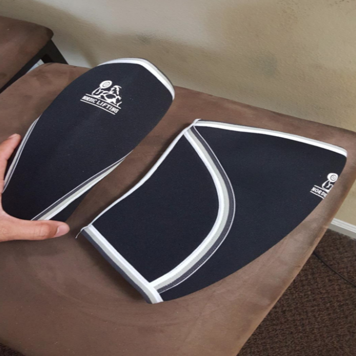 A reviewer holding the knee sleeves