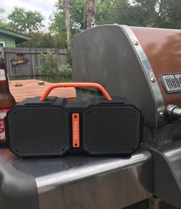 The speaker next to a barbecue