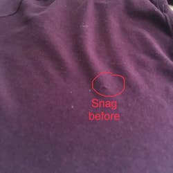 Reviewer photo of a snag in a shirt 