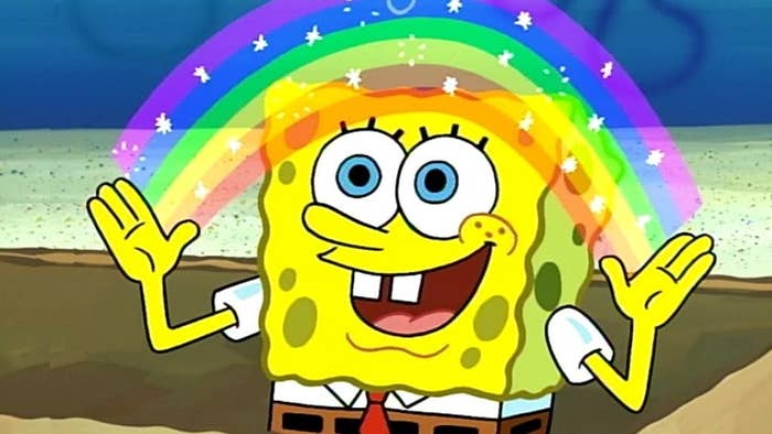 Spongebob standing in a box, happily creating a bright rainbow with his hands