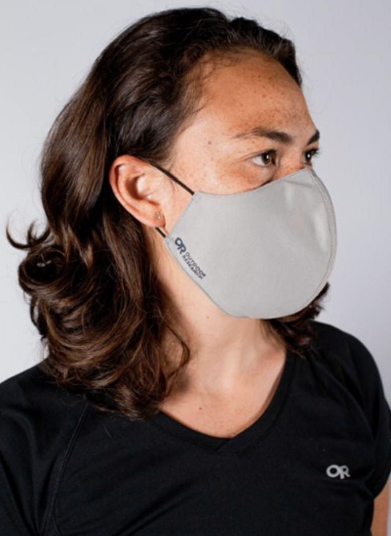 A model in a gray face mask