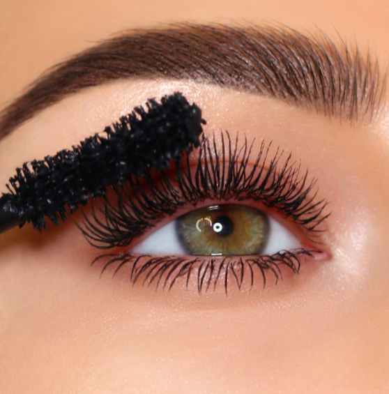 A model wearing the mascara and showing elongated lashes