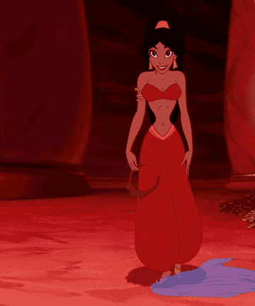 Jasmine looking sultry in her red outfit putting on a crown
