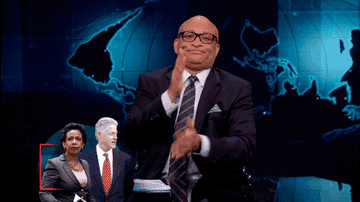 GIF of Larry Wilmore wiping his hands clean