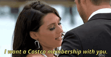 A woman telling her partner that she wants to share a Costco membership with him.