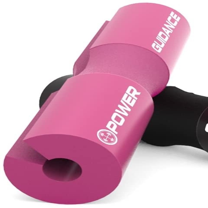 Two cylindrical squat pads, in pink and black, with a slit down the middle and an indentation for your neck