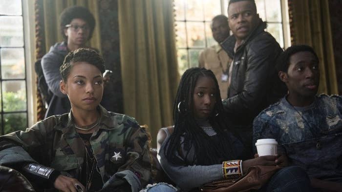 The cast of &quot;Dear White People&quot; sit on couches looking on in disbelief.