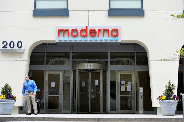 A man standing in front of an office building