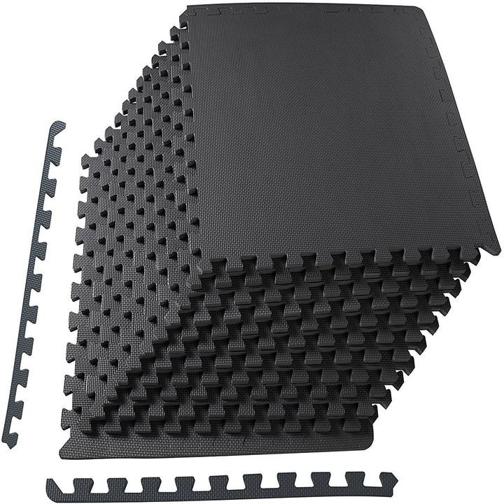 The black tile pieces with puzzled edges stacked and with edges that slot along the pieces to give them a flat edge