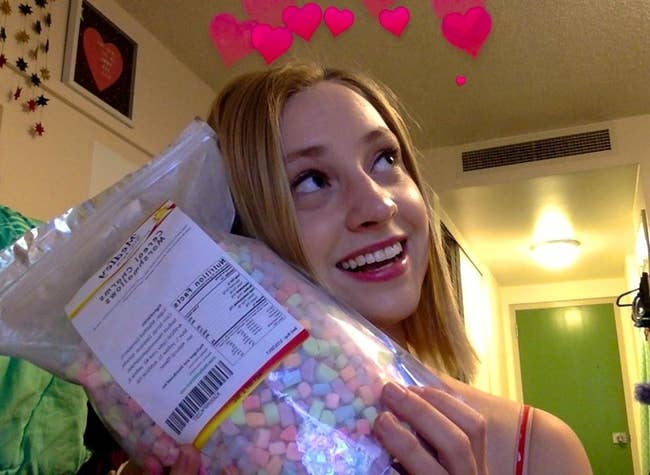 reviewer cradles large bag of marshmallows