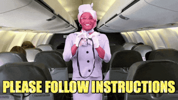 空飞机上空姐拉干酪的微笑而演示如何系好安全带。文本GIF说“请跟instructions"