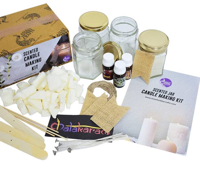 A scented candle making kit laid out alongside its box.