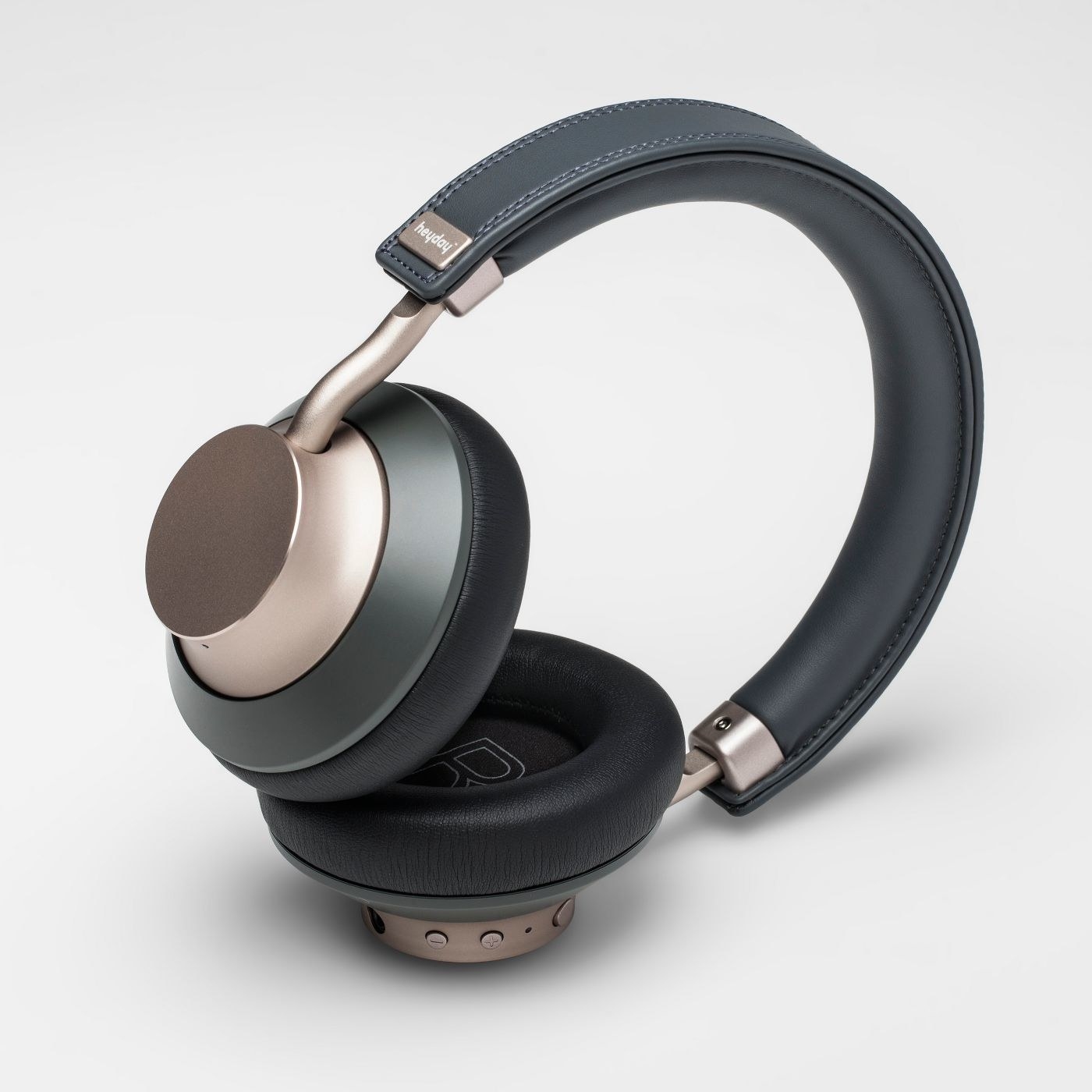 a pair of over-the-ear black and gold headphones