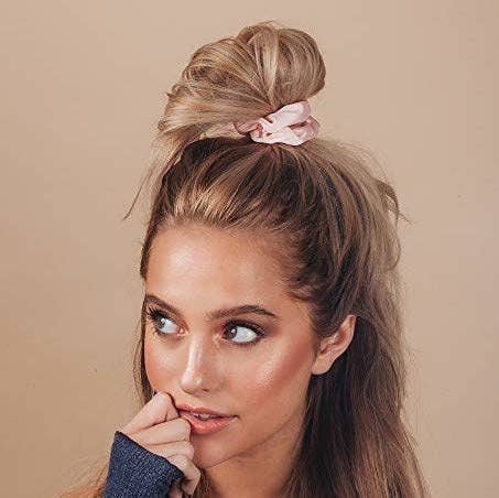 model wearing pink scrunchie in hair 