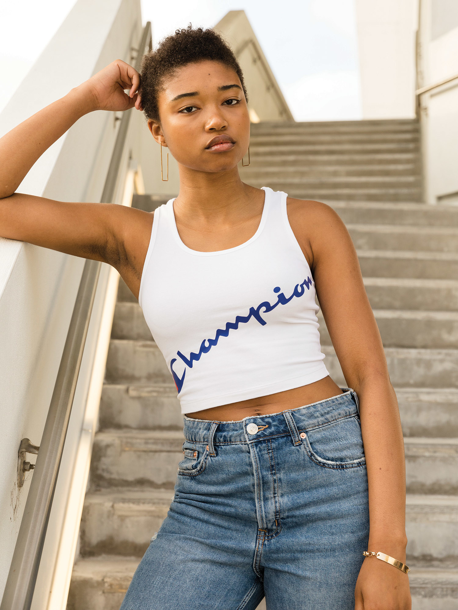 The white crop top with the word Champion across the middle